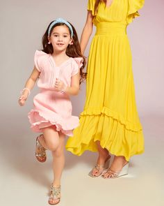 From playground to play date, dress your little one up in the Girls Lola Ruffle Mini Dress for her next day out with friends. Coordinate with your cutie by wearing the matching Lola Ruffle Mini Dress, and prepare to be the prettiest duo in sight. Summer Princess Ruffle Dress, Princess Style Ruffle Dress For Summer, Spring Twirl Dress With Ruffle Hem For Playdate, Spring Ruffle Dress For Playdate, Playful Twirl Dress With Ruffle Hem For Playdate, Ruffled Twirl Dress For Playdate, Summer Ruffle Dress For Playdate, Playful Ruffle Twirl Dress For Play, Playful Ruffled Twirl Dress For Play