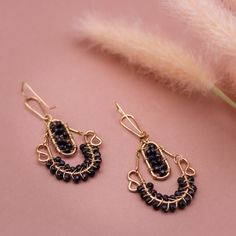 Black Onyx Drop Earrings - 14k Gold Filled, Lightweight, 2'' Dangle, Classic Black and Gold, Elegant Gemstone Jewelry" Description: These elegant 2-inch drop dangle earrings feature striking Black Onyx gemstones set in 14k gold filled hardware. Lightweight and designed for movement, these earrings offer a timeless combination of black and gold, perfect for any occasion. Whether you're dressing up for a night out or adding a touch of sophistication to your daily wear, these Black Onyx earrings ar Elegant Onyx Wire Wrapped Jewelry, Handmade Black Jewelry For Everyday, Black Handmade Jewelry For Everyday, Nickel-free Black Everyday Jewelry, Handmade Black Everyday Jewelry, Black Natural Stones Drop Earrings, Handmade Black Brass Jewelry, Black Teardrop Brass Jewelry, Black Teardrop Bohemian Jewelry