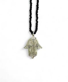 This necklace was made by a craftsman in southern Morocco, in the Anti-Atlas region. The necklace is made of Berber silver, it is not hallmarked, but it bears the blacksmith's signature on the back. This necklace is a protective talisman. The hand of Fatima, also called khamsa, or hand of Fatima, is a symbol used mainly in North Africa to protect against the evil eye. Its symbol is very present in Berber customs and beliefs, where it serves as protection and a good luck charm. The symbol represe Symbolic Sterling Silver Necklace For Festivals, Symbolic Beaded Jewelry For Festivals, Silver Amulet Style Beaded Necklace As Gift, Silver Amulet Style Beaded Necklace For Gift, Symbolic Festival Beaded Jewelry, Silver Amulet Beaded Necklace As Gift, Symbolic Beaded Necklaces For Jewelry Making, Handmade Sterling Silver Beaded Necklaces For Festivals, Handmade Sterling Silver Beaded Necklace For Festivals