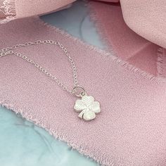 A dainty Silver Initial Charm Necklace with a lucky Four Leaf Clover. This dainty necklace is ideal for layering or wearing as a stand-alone signature necklace. • D E T A I L S •• 10mm charms• Sterling Silver• Dainty Style• 3 chain lengths available (16, 18, and 20 inches) Dainty Round Pendant Charm Necklace For Good Luck, Dainty Sterling Silver Flower Charm Necklace, Dainty Small Charm Necklace For Everyday, Tiny Delicate Pendant Charm Necklace, Dainty Flower Pendant Charm Necklace For Good Luck, Dainty Good Luck Flower Pendant Charm Necklace, Good Luck Charm Necklace With Delicate Chain, Delicate Sterling Silver Charm Necklaces, Dainty Sterling Silver Hypoallergenic Charm Necklace