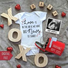 a baby's bodysuit with the words made with love on it and other items