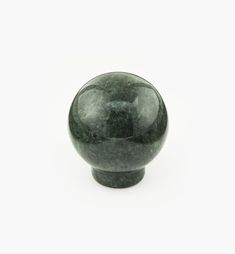 a green marble ball on a white background