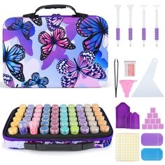 an assortment of crafting supplies including paint, scissors and glues in a case