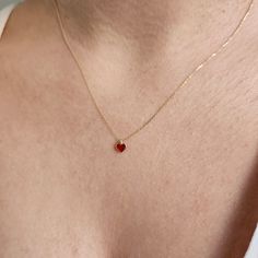 This 14K Gold Red Enamel Heart Necklace is designed carefully to brighten your neck. It is suitable for everyday use as well as for your special days. Can be a perfect gift with its stylish and ambitious look. The heart shape is universally recognized as a symbol of love and affection. Wearing heart jewelry can indicate a romantic relationship, deep emotional connection, or a loving sentiment toward someone as well as self-love and self-care. Heart jewelry, especially when given as a gift, can s Heart Necklace Aesthetic, Ruby Gold Necklace, Gold Neckles, Gold Minimalist Necklace, خواتم خطوبة, Small Pendant Necklace, Romantic Partner, Tiny Heart Necklace, Gold Minimalist Jewelry