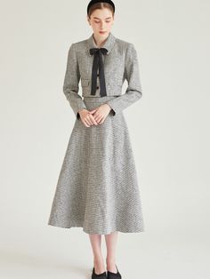 Editor's notesThis tweed skirt features relaxed, flare silhouette in maxi length. Subtle pearly texture adds to the feminine, romantic mood. - Lightweight tweed fabric- Voluminous A-line silhouette- Comfortable side pockets- Casual yet luxurious styleMeasurements(in.)Size (32(XS) / 34(S) / 36(M) )- Waist: 12.20 in / 13.19 in / 14.17 in - Length: 31.10 in / 31.3 in / 31.5 in * Model info: Height 5' 7, wearing Size 34Composition & Care- 10% Acrylic, 90% Polyester - Dry Cleaning only Designer- by IvanaHelsinki Elegant Tweed Skirt For Fall, Formal Tweed Skirt For Fall, Formal Fall Tweed Skirt, Spring A-line Tweed Dress, Tweed A-line Dress For Work, Elegant Tweed Skirt For Formal Occasions, Winter Midi-length Tweed Dress, Winter Midi Length Tweed Dress, Elegant Houndstooth Skirt For Office