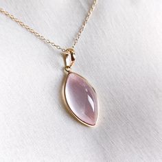 This stunning pendant is set in 14k Solid Yellow Gold with Natural Rose Quartz with utmost precision. It is an unique gemstone pendant for nearly every occasion and is completely hassle-free jewelry. 🔷ABOUT GEMSTONE:  Rose quartz is often called the "Stone of Love" and is believed to promote all forms of love, including self-love, romantic love, and love for others. It can help individuals open their hearts to love and develop a greater sense of compassion and empathy. Rose quartz is often call Marquise Jewelry With Gemstone Accents As Gift, Rose Gold Marquise Jewelry For Gifts, Elegant Marquise Gemstones For Gift, Elegant Jewelry With Bezel Setting For Valentine's Day, Exquisite Marquise Necklaces For Gifts, Elegant Rose Quartz Yellow Gold Jewelry, Exquisite Marquise Necklace For Gift, Elegant Bezel Set Jewelry For Valentine's Day, Elegant Pink Gold Jewelry With Bezel Setting