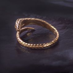 Beautiful Adjustable Snake ring in gold vermeil. The snake is the symbol of transformation and creation.  The detailed snake can be worn in any finger to match your look.  The ring comes packed in a box. Please avoid contact with chemicals. It is a 18k gold surface plating on sterling silver. It will fade over time and please do not use any silver cleaner.