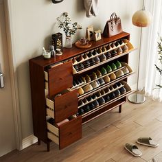 there is a shoe rack with many pairs of shoes on it