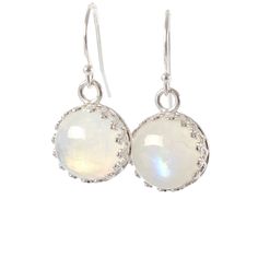 "Stunning Rainbow Moonstone Dangle Earrings made with genuine moonstone (June Birthstone) and set in sterling silver crown bezel setting. These earrings could make a wonderful gift for someone born in June! Just one pair available, and READY TO SHIP. MATERIALS: * natural rainbow moonstone * dangling from French hooks or leverbacks * Sterling Silver * come in our beautiful gift box + card about moonstone SIZE: * moonstones: 10x10 mm * earrings from top to bottom: - 1,8 cm or 3/4\" with french hoo Nickel-free Moonstone Earrings For Gifts, Dainty Nickel-free Moonstone Earrings, Dainty Moonstone Earrings Nickel Free, Nickel-free Moonstone Round Earrings, Nickel-free Moonstone Moon Earrings, Nickel-free Moonstone Moon-shaped Earrings, Silver Moonstone Birthstone Earrings, Moonstone Crystal Drop Earrings For Gift, Silver Moonstone Earrings With Birthstone