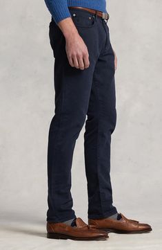 Soft and stretchy, these pants made of knit cotton sport classic five-pocket construction and a slim cut that tapers smartly to the ankle. 14" leg opening; 11 1/2" front rise; 16" back rise (size 34 x 32) 99% cotton, 1% elastane Machine wash, tumble dry Imported Casual Tapered Straight Bottoms, Stretch Chinos With Tapered Leg And Five Pockets, Straight Leg Elastane Jeans For Business Casual, Casual Straight Elastane Bottoms, Chino Cotton Twill Jeans With Straight Hem, Casual Elastane Pants With Five Pockets, Casual Straight Elastane Chinos, Classic Stretch Bottoms With Five Pockets, Fitted Everyday Pants With Standard Cut Leg