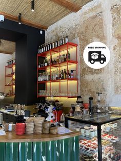 the inside of a restaurant with lots of food and drinks on display in front of it