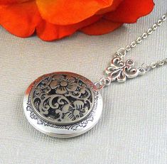 This elegant locket is 28 inches long. Antique finished round silver locket has beautiful engraved floral patterns on the sides. I have set a antique silver finished gothic style medallion filigree on the locket. Necklace is hanging from antique silver link. Heirloom locket is finished with antique silver chain and silver lobster clasp. Locket is 32mm in size. It has room for two photos inside! Please note: I DO NOT DO ENGRAVING OR INSERT PICTURES! Thanks for looking:) Mani Ornate Engraved Antique Silver Locket Necklace, Victorian Silver Round Pendant Locket Necklace, Ornate Silver Locket Jewelry, Silver Gothic Locket Jewelry, Victorian Silver Locket Necklace For Anniversary, Victorian Silver Locket Necklace With Intricate Design, Antique Silver Locket Necklace For Wedding, Antique Silver Locket Necklace With Intricate Design, Nickel-free Silver Locket Necklace For Wedding