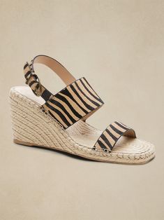 Instant sunshine.  These espadrille wedge sandals bring the effortless ease of long summer days to any outfit, crafted in a range of beautiful, textural suedes and printed haircalf leathers and wrapped in traditional jute fibers.  Suede or haircalf l Beach Straw Wedge Sandals With Cork-bed Midsoles, Summer Wedge Sandals With Cork-bed Midsoles For Vacation, Straw Sandals With Cork-bed Midsoles For Summer, Chic Straw Sandals With Cork-bed Midsoles, Chic Sandals With Cork-bed Midsoles, Chic Brown Straw Wedge Sandals, Chic Wedge Sandals For Beach Vacation, Chic Brown Straw Espadrilles, Natural Colored Espadrilles For Vacation