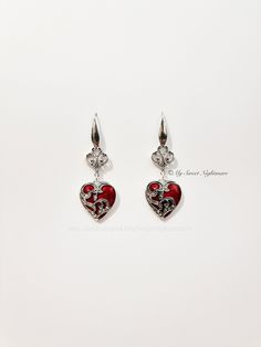 ◆ Gothic earrings with red heart The heart measures 0,905512 x 0,826772 inches and it's a really bright and intense red, the jewel is entirely silver plated The hooks are in 316 stainless steel, commonly called surgical steel and it is the "purest" steel on the market, a very corrosion resistant metal completely hypoallergenic and does not tarnish over time. ♡ In my shop there are many handmade jewelry for all tastes, come and watch them you are welcome! ♡ ❤ Do you need a custom order? ❤ You can Red Metal Heart Earrings For Party, Gothic Heart Charm Jewelry For Parties, Gothic Party Jewelry With Heart Charm, Red Heart-shaped Metal Earrings, Gothic Heart-shaped Wedding Jewelry, Red Double Heart Pierced Jewelry, Gothic Nickel-free Jewelry For Valentine's Day, Gothic Heart Charm Jewelry For Gifts, Gothic Jewelry With Heart Charm For Gift