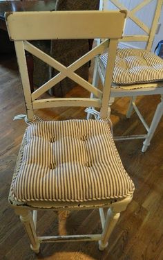 two chairs sitting on top of a hard wood floor