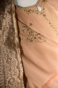 Gold Floor-length Kurta With Sheer Dupatta, Beige Anarkali Churidar With Traditional Drape, Beige Silk Sharara For Wedding, Beige Bollywood Style Floor-length Salwar Kameez, Wedding Beige Silk Sharara, Beige Silk Anarkali Set, Gold Salwar Kameez With Sheer Dupatta Floor-length, Festive Elegant Sherwani With Sheer Dupatta, Festive Beige Anarkali Kurta