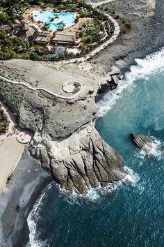 an aerial view of the ocean and resort