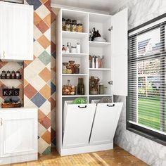 a kitchen with white cabinets and tiled walls