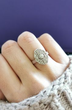 a woman's hand with a ring on it