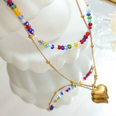 Style: Female Material: Titanium Steel, Imitation Pearl, Crystal Beads Pearl Type: Uncultured Pearl Color: White Necklace Length: 40 / 46)+5cm Heart Pendant:1.3*1.5cm Gold Heart Pendant, Stacked Necklaces, Heart Pendant Gold, Rainbow Crystal, Pearl Crystal, White Necklace, Pearl Types, Layered Necklace, Pearl Color