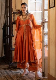 Paulmi & Harsh-Burnt Orange Anarkali Set-INDIASPOPUP.COM Elegant Anarkali Suits, Tissue Anarkali Dress, Embroidery On Orange Fabric, Tissue Fabric Dress Design, Silk Dresses Indian, Rust Orange Lehenga, Mehndi Gharara, Wedding Guests Outfits, Elia Martell