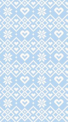 a blue and white knitted background with hearts