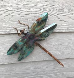 Dragonfly copper garden art sculpture by artist Catherine Murphy of Haw Creek Forge Size:Small 5.5" Wingspan(36" display rod)Large 10" Wingspan, 12" Long(36" display rod)Wall Hang 10" Wingspan, 12" Long(no display rod-cheaper shipping) Artist Catherine Murphy of Haw Creek Forge is a small business with a big reputation for quality, originality and service. In our riverside studio in the mountains of North Carolina, a small group of talented artisans carefully craft each piece of our unique and w Copper Garden Art, Big Reputation, Copper Garden, Dragon Flys, Copper Sculpture, Whimsical Garden Art, Copper Rod, Hang 10, Glass Garden Art