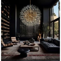 a living room filled with furniture and a large chandelier hanging from the ceiling