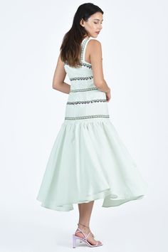 A feminine and flirty midi dress with thick shoulder straps, drop waist, pleated flounce skirt, and grapevine-inspired embroidery details, perfect for dressing up or down on your next getaway. Flounce Skirt, Swimwear Dress, Cotton Midi Dress, Dressing Up, Dress Jewelry, Embroidery Details, Knit Jacket, Drop Waist, Shoulder Straps