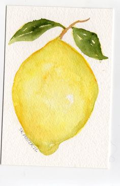 a watercolor painting of a lemon with green leaves