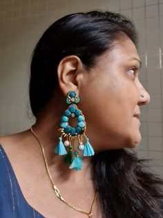 "Handmade statement teal green and turquoise smaller version stunning earrings. Made of handmade fabric cabochons in teal green and turquoise cotton fabric genuinely looks awesome. These handmade earrings are statement indeed. An ideal evening and party jewellery. The earrings measure approx. 3.30\" inclusive of the fringes and 1.75\" wide. This earring is a smaller version of my most popular oversized earring in the store. At Carnation jewellery, each piece is handmade and handcrafted in India, Blue Handmade Danglers For Festive Occasions, Green Danglers With Latkans, Green Dangle Chandelier Earrings With Latkans, Handmade Blue Drop Earrings, Blue Dangle Chandelier Earrings With Latkans, Bohemian Turquoise Chandelier Earrings For Party, Turquoise Bohemian Chandelier Earrings For Party, Blue Latkans Chandelier Dangle Earrings, Blue Chandelier Dangle Earrings With Latkans