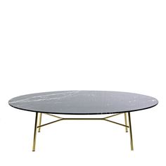 a table with a marble top and gold metal legs on an isolated white wall background