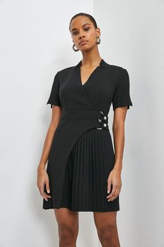 This dress is full of unexpected touches. Proving that it’s all in the details, the piece features an elegant notched collar, buckled detail at the waist (that’ll cleverly draw the eye in) and a cut-out pleated panel that’ll move as beautifully as you. Fitted V-neck Midi Dress With Belt, Black Fitted V-neck Belted Dress, V-neck Pleated Waist Dress For Work, V-neck Belted Dress For Work, Formal V-neck Dress With Belt, V-neck Belted Dress For Office, Tailored Mini-length Dress For Semi-formal Occasions, Dressy Mini Dress For Office, Dressy A-line Mini Dress For Work