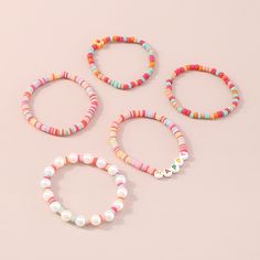 Vividly colored beaded bracelets with howlite that can arrange stacked for depth and dimension. Includes one stripe howlite beaded bracelet, one howlite 'Happy' beaded bracelet, one howlite flower beaded bracelet, one howlite ball beaded bracelet and one howlite and pearl beaded bracelet (five pieces total) Full graphic text: Happy. 6.1" L each Stretch Howlite / pearl / polymer clay / acrylic Stretch Lab, Flower Beaded Bracelet, Letter Bracelets, Heishi Bracelets, Pearl Beaded Bracelet, Chain Belts, Letter Bracelet, Maxi Dress Cocktail, Beaded Stretch Bracelet