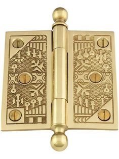 a brass plated door hinge with decorative designs on the front and side panels