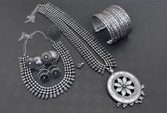 This beautiful set of 7 has a big long oxidized Haram necklace with a choker silver necklace, pair of jhumka earrings, a ring,pair of bangles,toerings and a nose pin. Grab this beautiful set with any of the ethnic/ Indo western outfit and look unique in the crowd Premium quality set!! Indian Jewelry Traditional, Jewelry Traditional, Choker Silver, German Silver Jewelry, Traditional Indian Jewellery, Western Outfit, Nose Pin, Jewellery Sets, Silver Jewellery Sets