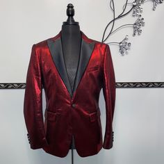 This Blazer Features A Beautiful Metallic Red Finish, 65% Polyester 35% Cotton Fabric, With Front Pockets And Front Button Closure. Red Festive Semi-formal Blazer, Designer Red Blazer For Business, Red Party Suits For Fall, Luxury Red Party Suits, Red Tailored Evening Blazer, Tailored Red Evening Blazer, Luxury Red Suits For Winter, Luxury Red Long Sleeve Suits, Elegant Red Suits For Fall