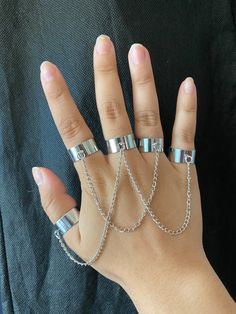 Five chain linked rings that can be worn in any way. The rings are adjustable, so one size fits all. Ring On Chain, Rings With Chains, Chained Rings, Rings Chain, Ring With Chain, Metal Promise Ring With Adjustable Chain, Ring Chain, Adjustable Midi Rings With Open Ring Design, Silver Chain Metal Ring As Gift