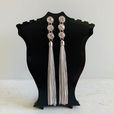 Long Tassel Stud Earrings Perfect For Going Out On Saturday Night, A Trip To Vegas Or Adding Some Flair To Your Out Fit Long Drop Metal Tassel Earrings For Party, Metal Tassel Earrings For Party, Silver Tassel Earrings For Evening, Chic Silver Tassel Earrings For Party, Chic Silver Jewelry With Tassels, Elegant Metal Dangle Tassel Earrings, Silver Dangle Tassel Earrings With Fringe, Long Drop Tassel Earrings For Party, Elegant Silver Tassel Earrings For Evening