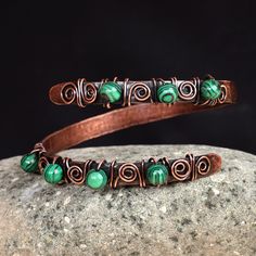 The unique free-form design of this spectacular wrap bracelet draws inspiration from rich Armenian art. Artisans Hasmik and Musheg create this alluring accessory that seamlessly blends copper wires and textured sheets with a captivating antique finish, adorned with enchanting malachite beads. Copper Bangle Bracelets, Antique Copper Jewelry, Handmade Copper Bracelet, Wired Jewelry, Malachite Bracelet, Copper Wire Jewelry, Malachite Jewelry, Copper Cuff Bracelet, Copper Sheets