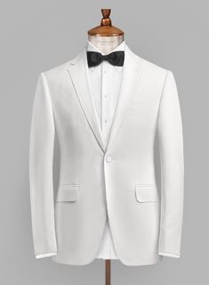 Not all dressy events require the formality of a tuxedo, for some a White Dinner jacket will suffice. This style does make an excellent secondary jacket to look cooler than everyone in the room when worn.   Tuxedos are great way to standout from the crowd, while maintaining an everlasting elegant aura. Wear it with a pair of high-shine black derby shoes, a white dinner shirt and an oversized black bow tie.   Featuring matching fabric covered buttons and gentle texture at its surface, our tuxedo White Dinner Jacket, Subtle Fashion, White Dinner, Dinner Jacket, Black Bow Tie, Fabric Covered Button, Derby Shoes, Rayon Fabric, Black Bow