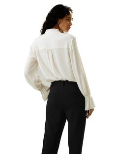 The palace pleat design on the cuffs adds an extra element of sophistication, creating an atmosphere of refined elegance. Whether it's for work or casual outings, this blouse is versatile and suitable for any occasion. 23MM Ghost Crepe V-neck Neckline ribbon Pleated cuffs Suitable for casual work and vacations Elegant Silk Top For Business, Elegant V-neck Top With Cuffed Sleeves, Chic Silk Business Blouse, Chic Silk Blouse For Business, Elegant V-neck Blouse For Office, Classic Formal Blouse With Open Cuff, Elegant V-neck Top With Button Cuffs, Office Blouse With Blouson Sleeves, Elegant Silk Tops For Business Casual