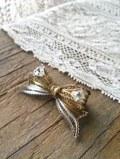 "Delicate antique 800 silver, two tone gold washed and bright silver filigree bow brooch. Highly detailed, three dimensional, very good condition, no broken or missing pieces, safety c pin back works well, holds securely. Measures 1 3/4\" x 7/8\". **Shipping includes insurance, when available**" Silver Bow Brooch For Wedding, Vintage Wedding Brooches With Bow, Vintage Wedding Brooches With Bow Detail, Vintage Jewelry With Decorative Bow As Gift, Vintage Wedding Brooch With Bow, Vintage Wedding Brooch With Bow Detail, Vintage Wedding Jewelry With Bow Detail, White Antique Brooches As A Gift, Antique White Brooches As Gift