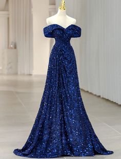 a blue dress on display in a room