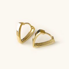 One pair of cool and modern hoop earrings handcrafted in 14K solid gold. The Triangle shape gives basic hoops a fresh new look. Ships within 3 business days. - Earring size: 12mm - Earring width: 2.5mm - Inner diameter: 10mm - Sold as A Pair. - Made in 14 karat gold. - Stamp with 14K. Gold Bali Earrings Indian, Gold Bali, Modern Hoop Earrings, Bali Earrings, Gold Triangle, Bangles Jewelry Designs, The Triangle, Diamonds And Gold, Gold Earring