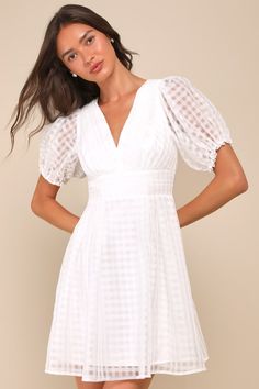 Let your adorable style and the Lulus Cultivated Cuteness White Burnout Gingham Tie-Back Mini Dress pave the way to an unforgettable summer! Lightweight woven organza boasts a burnout gingham pattern as it shapes short puff sleeves with elastic and ruffles at the cuffs. Fitted bodice has a V-neckline and chic pleated details, atop a banded waist with matching pleated accents. Turn around to reveal a flirty open back with a tie at the top. Flaring skirt finishes at a mini hem. Smocked panel and h Knot Tie Dress, Adorable Style, Your Adorable, Puff Sleeve Mini Dress, Petal Sleeve, Gingham Pattern, Smocked Dress, Tie Dress, Mini Dress With Sleeves