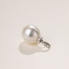 Material: 18K white gold, Teardrop South Sea Pearl, and diamonds South Sea Pearl saltwater cultured pearl Size of pearl: 12.0-13.0 mm The price of this product is only the pendant price, and a 45cm adjustable 925 silver chain is given as a gift. Weight of Diamonds: 9 diamonds approx. 0.086 carats Handpicked of every pearl, only the top 1% of pearls are selected Handcrafted Lifetime warranty Luxury Drop Pearl Necklace, White Gold Pearl Pendant Necklace In Drop Shape, White Gold Teardrop Pearl Necklace With Charm, White Gold Drop Jewelry With Pearl Charm, White Gold Drop Pearl Necklace, Formal Drop Pearl Necklace In White Gold, Formal Pear-shaped Diamond Pearl Necklace, Formal Drop White Gold Pearl Necklace, Formal Drop-shaped White Gold Pearl Necklace