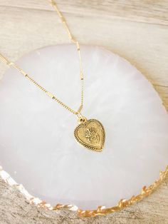 Share your love of the Sacred Heart of Jesus with our Heart Shaped Sacred Heart Necklace. Featuring a vintage style chain with an image of the Sacred Heart. Makes a lovely gift for Confirmations or First Holy Communions. 18" vintage style chain 14k gold ox over brass This piece is designed and made by Amano Studio, a small, woman owned jewelry brand and studio based in Sonoma California Sacred Heart Necklace, The Sacred Heart Of Jesus, Sonoma California, The Sacred Heart, Sacred Heart Of Jesus, Heart Of Jesus, First Holy Communion, Jewelry Brand, Holy Communion