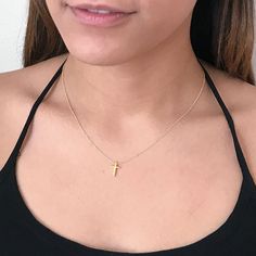 This tiny gold cross necklace is a classic addition to your layering necklaces. This minimalist necklace is also perfect by itself. - The cross charm is gold plated over sterling silver and measures approximately 12 mm in length or 1/2 inch. The dainty chain is 14k gold fill. This cross necklace is available in lengths from 14 - 20 inches. The model is wearing a 16 inch length. - Your new tiny cross necklace will come in a box, ready for gift giving. More Christian jewelry https://www.etsy.com/s Baptism Gift Ideas, Christian Cross Necklace, Cross Necklace Gold, Tiny Cross Necklace, Dainty Cross Necklace, Cross Necklaces, Tiny Cross, Layering Necklaces, Gold Cross Necklace