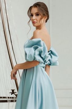 This lovely short A-line blue satin homecoming dress features a classic off-the-shoulder design, perfect for a formal and elegant look. Crafted from high-quality satin, this dress offers a luxurious drape and comfortable fit. Effortlessly turn heads and make a statement with this stunning dress. Blue Satin Bridesmaid Dress For Prom Season, Elegant Blue Off-shoulder Dress For Evening, Satin Mini Dress For Banquet During Prom Season, Knee-length Satin Mini Dress For Banquet, Elegant A-line Evening Dress For Homecoming, Banquet Satin Mini Dress With Sweetheart Neckline, Formal Satin Off Shoulder Dress With Fitted Bodice, Knee-length Satin Mini Dress For Homecoming, Satin Mini Dress With Sweetheart Neckline For Banquet